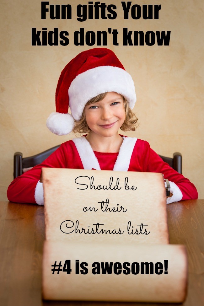 Child writing on the typewriter. Christmas paper scroll. Xmas holiday concept
